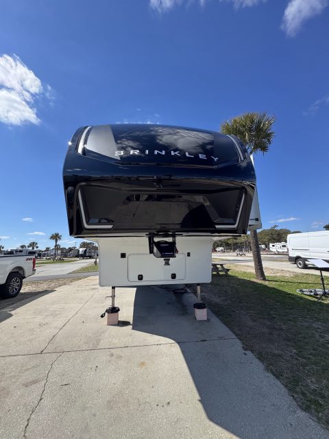Gloss-black Brinkley fifth wheel front cap after a ceramic shield installation