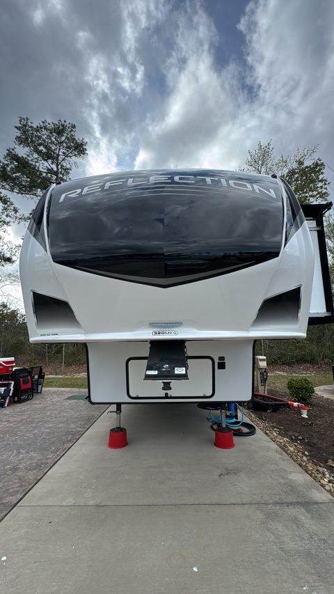 Grand Design Reflection fifth wheel front cap after ceramic coating, gloss-black graphics free of bug etching