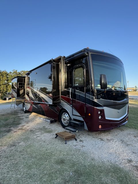 Detailed black and burgundy Fleetwood motorhome