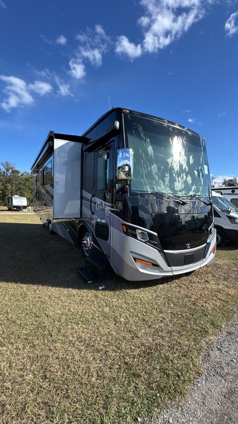 Luxury motorcoach set up at a campsite after detailing