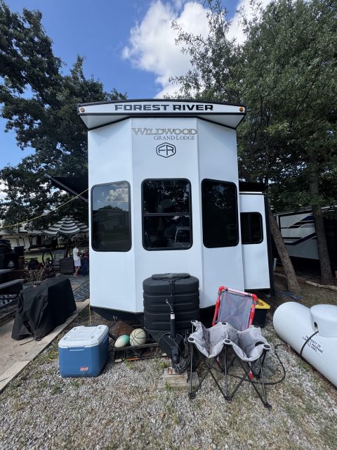 White Forest River Wildwood travel trailer at a campsite